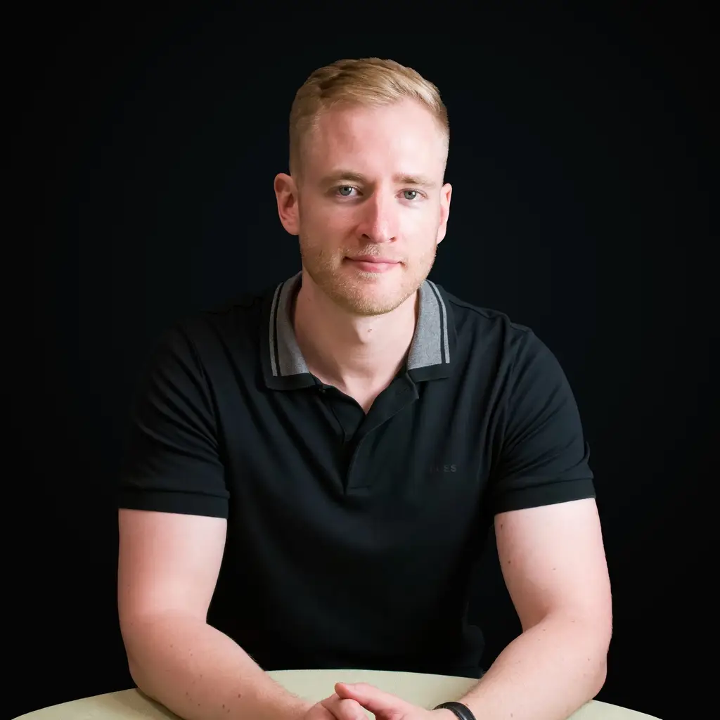 Formal headshot of Sean Backhouse, experienced UX Designer with a focus on cloud-based solutions and SaaS platforms.